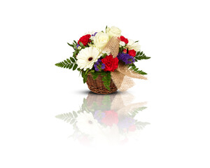 Obraz na płótnie Canvas Colorful bouquet of flowers in a woven basket vase isolated on white background with clipping path