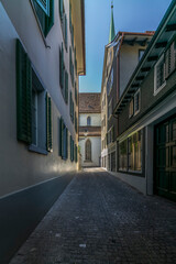 A hidden narrow alley in the center of Zurich in early summer
