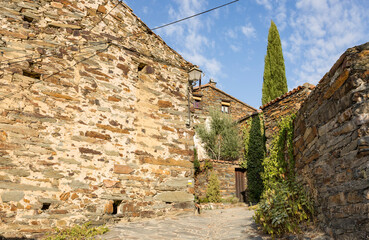 a street with traditional architecture in Patones de Arriba ancient village, Community of Madrid, Spain