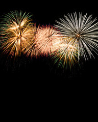 Close-up of colorful fireworks in black background