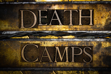 Death Camps text with barbed wire on vintage textured grunge copper and gold background