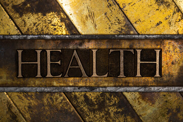 Health text on vintage textured grunge copper and gold background