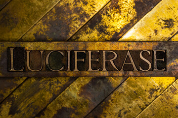 Luciferase text on vintage textured grunge copper and gold background