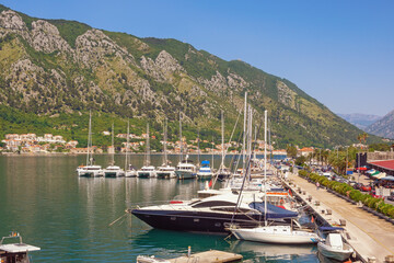 Fototapeta na wymiar Montenegro, Kotor city. View of embankment and port near Old Town