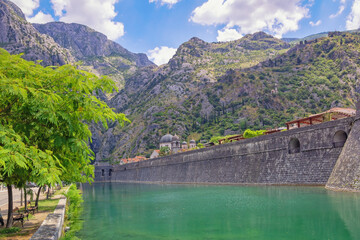 Montenegro, Kotor city.  View of Skurda river and northern walls of  Old Town of Kotor on summer day