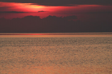 Evening sun over the tropical sea with waves. Nature background