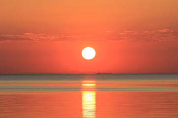 Evening sun over the tropical sea with waves. Nature background
