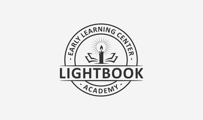 education academy logo design with the candle and book element.