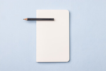 Empty notebook ready for mockup on blue table, top view, flatlay.