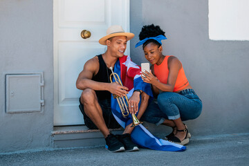 Relaxed latin american man and woman checking a phone