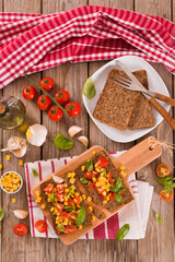 Rye bread withsweet  corn, basil and tomato.