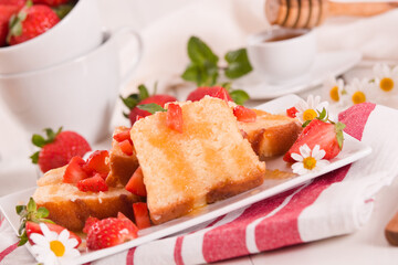 Lemon pound cake with honey and fresh strawberries.