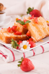 Lemon pound cake with honey and fresh strawberries.