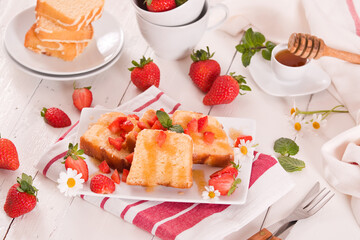 Lemon pound cake with honey and fresh strawberries.