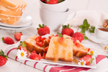Lemon pound cake with honey and fresh strawberries.