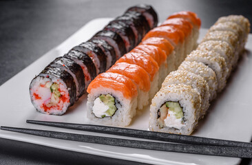 Delicious fresh rolls in various sets. Japanese food with avocado, shrimp, crab and salmon