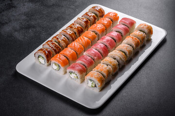 Delicious fresh rolls in various sets. Japanese food with avocado, shrimp, crab and salmon