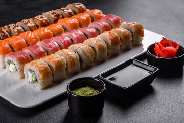 Delicious fresh rolls in various sets. Japanese food with avocado, shrimp, crab and salmon