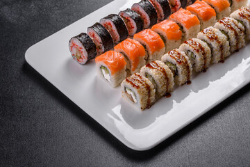 Delicious fresh rolls in various sets. Japanese food with avocado, shrimp, crab and salmon
