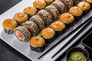 Delicious fresh rolls in various sets. Japanese food with avocado, shrimp, crab and salmon