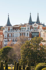 View of buildings with unique roofs in the center of Madrid, next to the Retiro park.