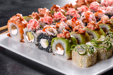 Delicious fresh rolls in various sets. Japanese food with avocado, shrimp, crab and salmon