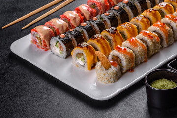 Delicious fresh rolls in various sets. Japanese food with avocado, shrimp, crab and salmon