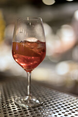 glass with pink drink with blurred background