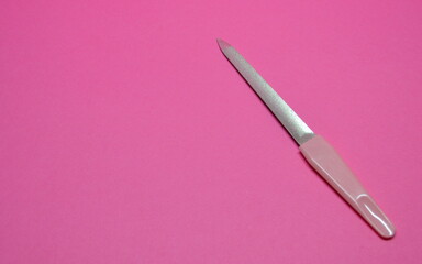 file for polishing nails for work of the nail master on a pink background