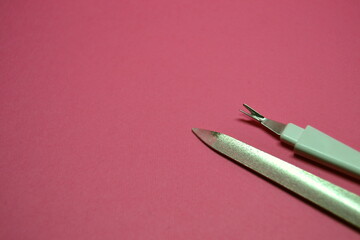 file for polishing nails for work of the nail master on a pink background