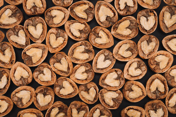 Walnuts. Background of fresh walnuts.  Abstract walnuts heap pattern background. Natural food in-shell nuts. Natural walnut background pattern texture.