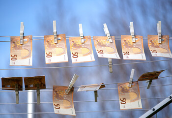 100 and 50 euro banknotes drying. Washed Euro paper bills. Drying euro on a string.Money laundering