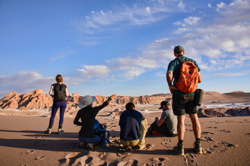 Trekking through the desert landscape in the Moon Valley, San Pedro de Atacama, Chile