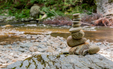 Fototapeta na wymiar Rocks stacked on top of each other next to a river in North Carolina