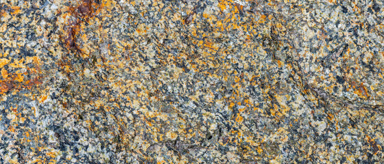 Texture of the rocky surface. Granite texture as nature background. Natural gray granite with a grainy pattern