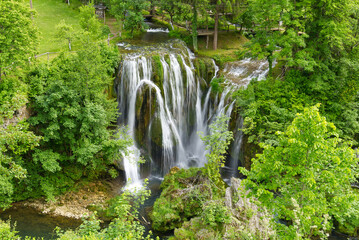 Fototapeta na wymiar Beautiful waterfall in Slunj, Croatia during summer season. Travel destination in croatia, must visit concept