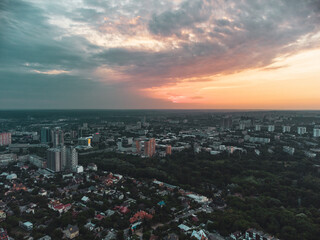 Aerial epic sunset evening cloudscape, panoramic view in summer city recreation park Sarzhyn Yar. Botanical garden in residential Shatilovka district area, Pavlovo Pole, Kharkiv Ukraine