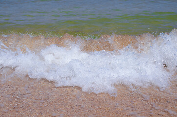 Waves on the sandy beach. Summer background. Background design, photo wallpapers, covers,...