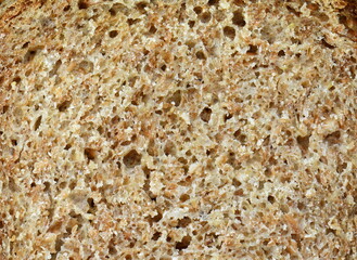 Whole Wheat Bread Texture. High resolution brown bread texture background. Texture of brown bread baked from rye flour. 
