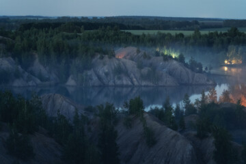 Fototapeta na wymiar Fog on the water in Romantsevskiye Gory, Konduki. Tula oblast, Russia. Camping in nature landscape at night. Popular touristic weekend destination