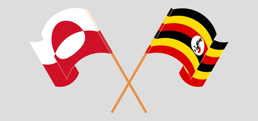 Crossed and waving flags of Uganda and Greenland
