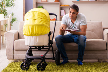 Young male contractor looking after new born at home