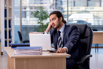 Young businessman employee working in the office