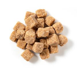 Brown cane sugar cubes placed on a white background.
