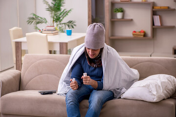 Young man suffering at home
