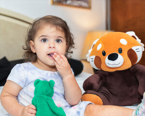 little child playing with toy