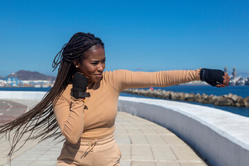 Young black girl training outdoors