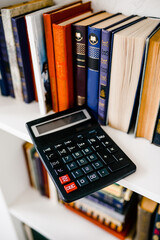 stack of books and calculator