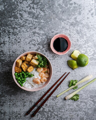 asian rice noodle soup with fried tofu and shrimps