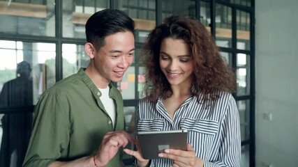 Gen z millennial teenagers Asian guy and latin Hispanic girl using mobile cell phone applications. Diverse high school students testing startup business develop project. Collaborate diversity concept. - Powered by Adobe